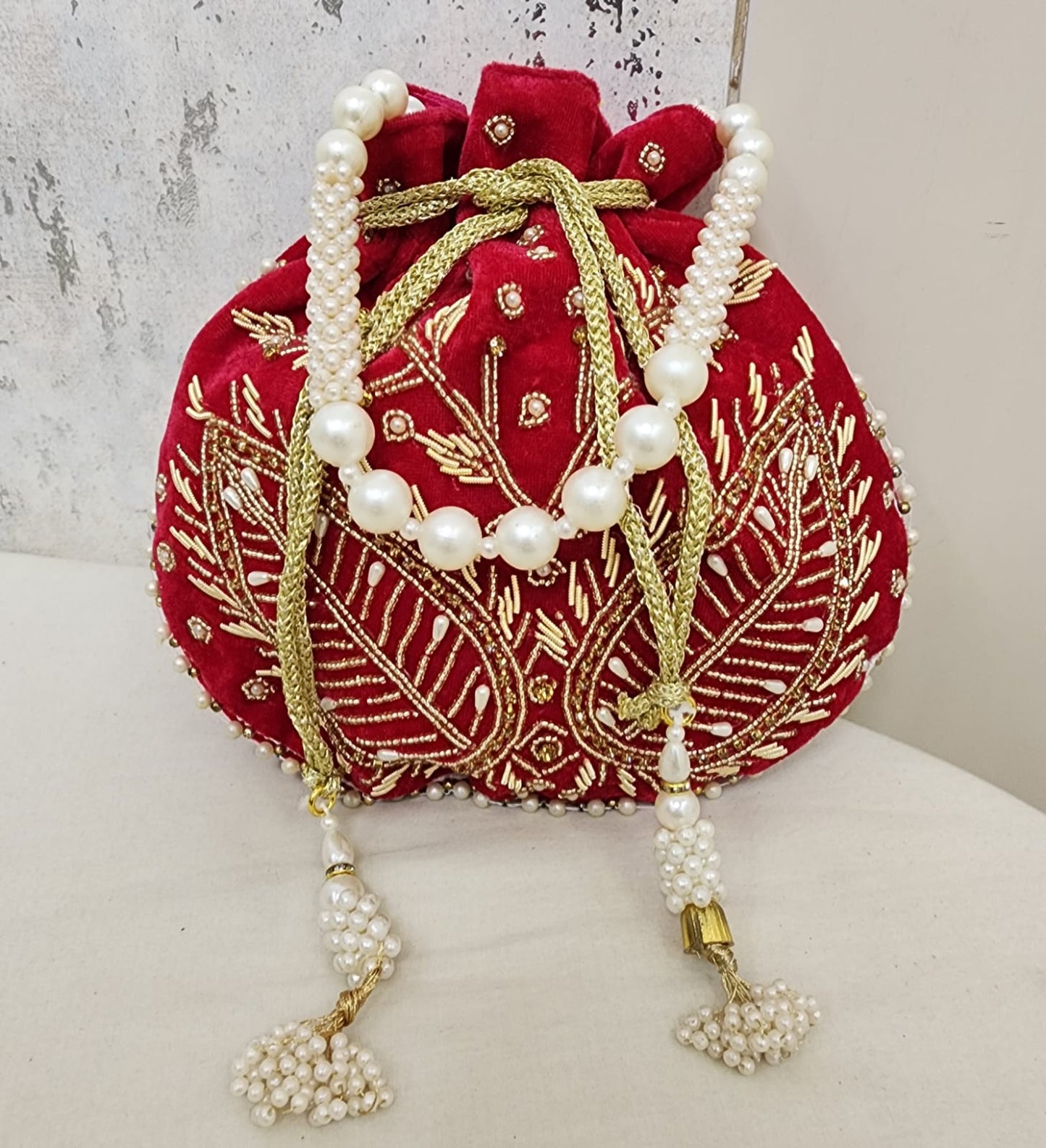 Royal Velvet Potli Bag with Pearl Handle & Zari Embroidery