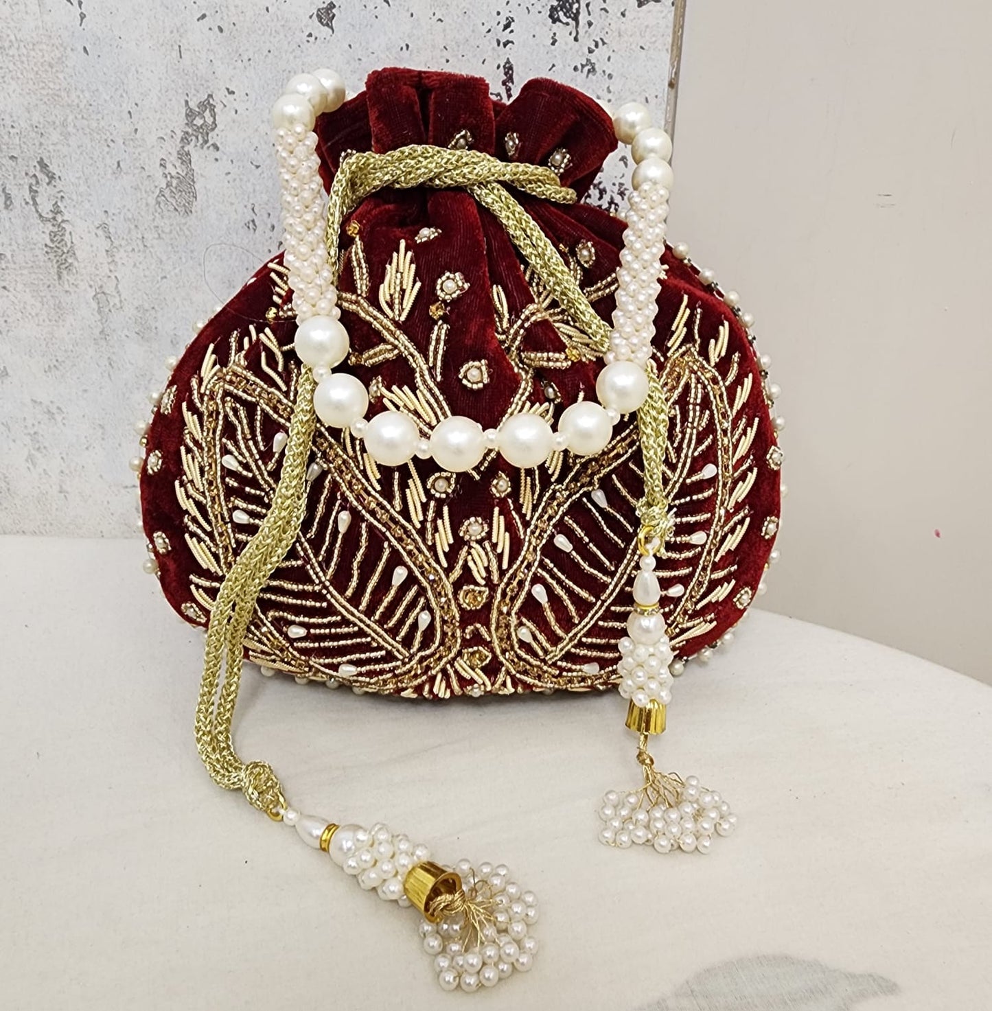 Royal Velvet Potli Bag with Pearl Handle & Zari Embroidery