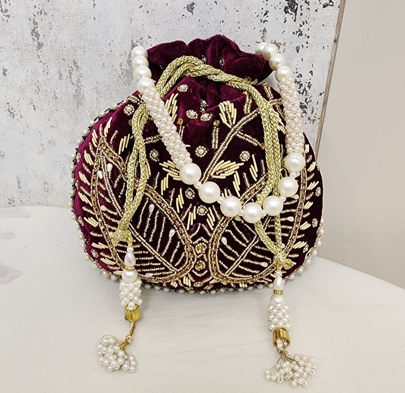 Royal Velvet Potli Bag with Pearl Handle & Zari Embroidery